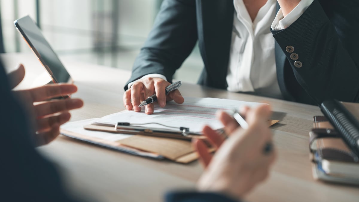 TTMN SOLUTIONS consultants collaborating in a modern office